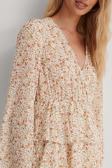 Elegant White Crepe Floral Dress with Flutter Sleeves & Layered Flounce