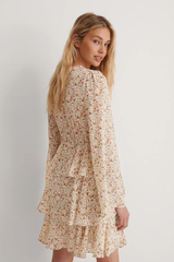 Elegant White Crepe Floral Dress with Flutter Sleeves & Layered Flounce